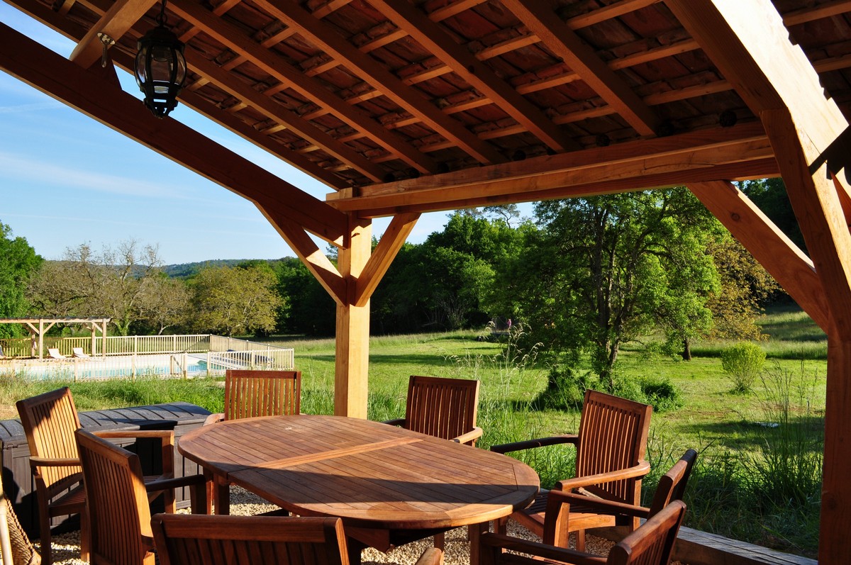 Dinner on the terrace — the abri lit for a group evening
