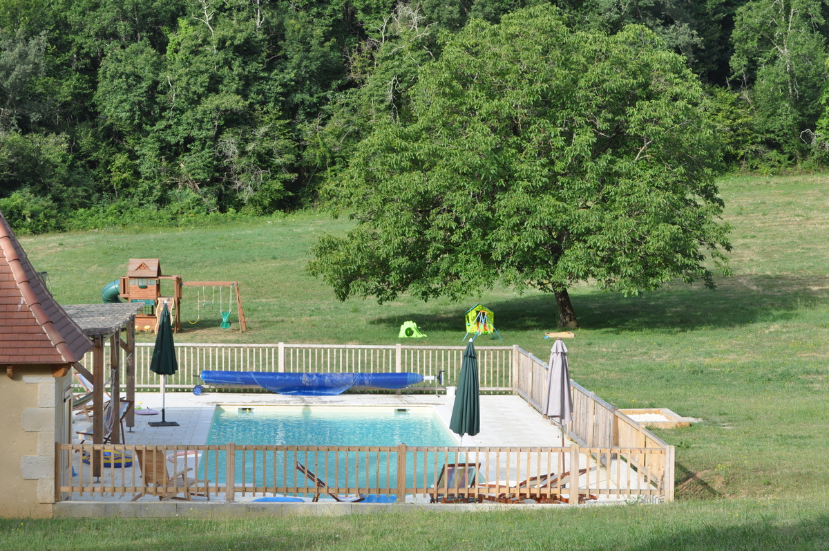 The Sol du Mazel pool — clear heated water, sun loungers, afternoon light